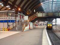 The former station signal box at York, later the Station Masters office known as the <I>glass palace,</I> is now a coffee shop on Platform 3. 43056 is on the rear of a Sunday Kings Cross service.<br><br>[Mark Bartlett 12/10/2008]