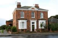 Station House, Hornsea, stands in the rain facing Railway Street on 1 October 2008. The arched portico that once served as the main entrance to the terminus can be seen in Station Mews on the left. <br><br>[John Furnevel 01/10/2008]