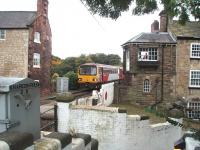 A candidate for the Top 10 surviving unusual signal boxes must be Knaresborough, stone built on the side of another building as shown. The white brickwork in the foreground is the subway entrance and there is a controlled pedestrian level crossing too. 144020 has just crossed over after arriving from Leeds and is setting back into the station ahead of the return journey.<br><br>[Mark Bartlett 11/10/2008]