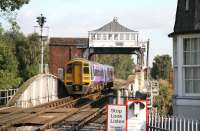 The 0953 Northern York - Hull service crosses the River Ouse on Selby swing bridge on 29 September shortly after leaving the station. <br><br>[John Furnevel 29/09/2008]