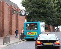 Built in 1863 by the Stockton and Darlington Railway, Darlington Locomotive Works, or <I>North Road Shops</I> as it was known locally, became the towns largest employer (peak of 3,815 in 1954). Following its eventual closure in 1966, the site lay derelict for some time but is now occupied by a number of retail outlets, including a large Morrisons Superstore. This view up North Road on 4 October 2008 shows the refurbished Darlington Works clock, now attached to the east wall of the Superstore and serving as a small memento of what once stood there.<br><br>[John Furnevel 04/10/2008]