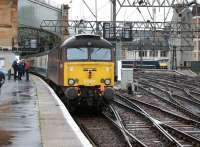 The rear locomotive of the <I>Electric Scot</I> railtour, West Coast Railway Co 57601, at Glasgow Central on 15 October, with an NXEC service waiting to leave from platform 1 in the background. <br><br>[John McIntyre 15/10/2008]