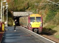 Emerging from Fairlie tunnel and pulling into the station on 15 October is 334 004 on a Largs - Glasgow Central service. <br><br>[David Panton 15/10/2008]