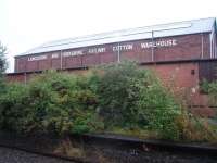 <I>Not just any old warehouse but....</I> Although the station buildings at New Hey have long been demolished this former goods shed behind the Rochdale platform is a very big reminder of the main source of revenue on the line for many years.<br><br>[Mark Bartlett 30/09/2008]