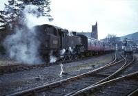 SLS <I>Scottish Rambler No 3</I> Railtour leaving Moffat on 29 March 1964 on the short journey back to Beattock behind BR Standard class 4 no 80118. Moffat station had closed to passenger traffic 10 years earlier.<br><br>[Robin Barbour Collection (Courtesy Bruce McCartney) 29/03/1964]
