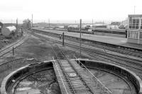 View south over the old locomotive turntable and out towards Galway Bay in 1991 as a train waits to leave Galway station on a service for Dublin Heuston.<br><br>[Bill Roberton //1991]