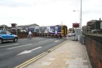 A Northern DMU rumbles over the level crossing and into the eastbound platform at Goole station on 29 September with the 1047 Doncaster - Hull sevice.<br><br>[John Furnevel 29/09/2008]