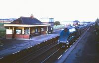 An A4 Pacific photographed with a southbound train at Alyth Junction in the 1960s looking towards Forfar. The station was built by the Dundee & Perth and Aberdeen Junction Railway and opened in 1861 as Meigle, with the name change to Alyth Junction occurring in 1876. Final closure came in September 1967.<br><br>[Robin Barbour Collection (Courtesy Bruce McCartney) //]