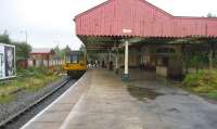 It is unclear yet what will survive the Metrolink conversion at Oldham Mumps. The long term plan, if funding can be found, is to bypass the station altogether by street running through the town centre. View north as 142060 leaves for Shaw and Crompton.<br><br>[John McIntyre 30/09/2008]