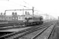 CIE 163 runs into Dublin Connolly station to pick up a train on a rainy afternoon in 1988.<br><br>[Bill Roberton //1988]