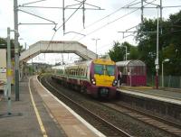 334 028 runs into Carluke on 15 September 2007 with a Lanark - Dalmuir service.<br><br>[David Panton 15/09/2007]