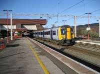 A class 350 EMU pauses at Birmingham International on its journey eastwards to Coventry on 29 November 2006.<br><br>[John McIntyre 29/11/2006]