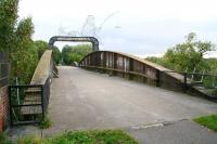 In addition to the more famous example at Selby, another swing bridge by-passed by the ECML as a result of the 1983 rerouting was this one at Naburn. View is southeast over the River Ouse on 30 September 2008 on what is now part of a long distance walk/cycleway. The control cabin that once stood above the centre of the bridge has long been removed, with the spot now occupied by a <I>wire sculpture</I>.<br><br>[John Furnevel 30/09/2008]