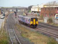 The <I>12 mile siding</I> that is the Blackpool South branch operates pretty much at capacity for most of the day. 150224 has just left the branch, which starts by the bridge, and the signal for the next service has already cleared. The train is about to call at Kirkham & Wesham on its way to Preston and Colne.<br><br>[Mark Bartlett 29/10/2008]