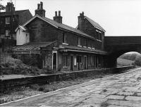 <I>A curious place to put the loo</I>. When I first started using this line in late 1968 the stations had already been destaffed but all the buildings were still in place. In 1970 when the branch was singled all station buildings were demolished except Ewood Bridge, albeit it was by then derelict. The unusual structure above the public toilet block is the toilet for the station house. Another feature I remember from the declining final years was the water running off the hillside, over the platform and onto the trackbed as seen here. The building was demolished after full closure and the platforms removed and have not been replaced since preservation of the line. Mark Bartlett<br><br>[W A Camwell Collection (Courtesy Mark Bartlett) 27/05/1972]