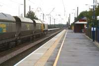 <I>The race track</I> is the unofficial name given to Britains longest straight stretch of main line, being that part of the ECML covering the 30 miles or so betweeen Northallerton and York, of which two thirds is almost dead straight. View is from the down platform at Northallerton on 3 October 2008 as a Freightliner class 66 heads south towards York with coal hoppers. The train is signalled for the up slow line beyond the platform.<br><br>[John Furnevel 03/10/2008]