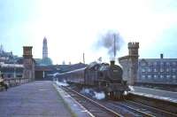 A grimy looking Fairburn 2-6-4 tank about to depart from Greenock Central with a Glasgow bound train on 27 August 1965.<br><br>[G W Robin 27/08/1965]