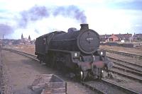 Ex-LNER Thompson B1 No 61132 stands in the yard at Anstruther in August 1965. Photograph taken from the passing RCTS <I>Fife Coast Railtour</I>.<br><br>[G W Robin 28/08/1965]