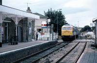 1983 - 1984 was a time of major transition on the East Suffolk line from Ipswich to Lowestoft. To ensure its survival, sections of the line were singled, signalling was simplified and loco-hauled workings withdrawn. Here, wrong line working is in force in connection with the singling process as 47150 creeps through Saxmundham with the last down SO London Liverpool Street (10.52) to Lowestoft express on 10 Sept 1983. This was a summer service for Londoners heading for holiday camps around Lowestoft. Passengers returned to London behind 31239 on the last up working the following Saturday, bringing to an end a long tradition of <I>holiday camp expresses</I> on the line.  <br><br>[Mark Dufton 10/09/1983]