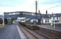 A diesel hauled freight heads south through Dunblane in 1965 when the station was still a junction for the line to Callander.<br><br>[G W Robin 27/07/1965]