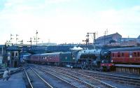 A2 Pacific 60532 <I>Blue Peter</I> brings a train into Buchanan Street in August 1966. The locomotive was at that time allocated to 62B Dundee Tay Bridge shed, from which it was officially withdrawn by BR 4 months later on 31 December 1966. Named after the winner of the 1939 Derby, the now preserved <i>Blue Peter</i> is the sole survivor of the 15 original Peppercorn A2s.<br><br>[G W Robin /08/1966]