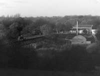 Narrow gauge explosives train, hauled by Ruston 4wDM loco No.7, crossing the Douglas Valley viaduct on the short, two foot gauge, line linking the Nobel's Roburite factory at Shevington with the exchange sidings at Gathurst station in 1978. [See image 21338]. [Apologies for the quality of the picture - I only visited the location once to capture the workings. The viaduct and railway have since been demolished but No. 7 is preserved and has been restored to working order by the Moseley Railway Trust at the Apedale Heritage Centre in Staffordshire] <br><br>[Mark Bartlett 28/11/1978]