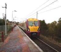 A Wemyss Bay - Glasgow Central service calls at Whinhill on 1 November formed by unit 334 015.<br><br>[David Panton 01/11/2008]