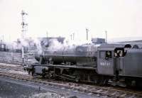 Stanier 8F 48727 providing footplate rides to young enthusiasts at Rose Grove, Burnley, in the mid 1960s - occasion unknown. Photographed from the platform at Rose Grove station with the old shed in the background.<br><br>[Robin Barbour Collection (Courtesy Bruce McCartney) //]