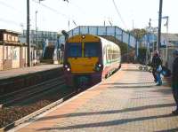 An Ayr - Glasgow Central 6-car train with 334 018 leading runs into Newton-on-Ayr station on 1 November 2008.<br><br>[David Panton 01/11/2008]