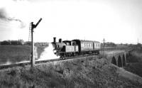 There are two months to go before the end of passenger services to Holcombe Brook. Woolfold signal box is evidently switched out as L&YR 2-4-2T 50731 propels its single coach away from Woolfold station (SD 789121) and onto the viaduct as it heads for Bury. On the back of this print it is credited to N R Knight.<br><br>[W A Camwell Collection (Courtesy Mark Bartlett) 05/03/1952]