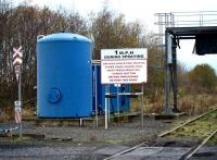 Spraying equipment used to settle dust on loaded coal hoppers at Thornton Yard, seen from the level crossing on 8 November.<br><br>[Brian Forbes 08/11/2008]