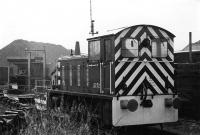 As the coal depot shunter at Blackburn King St Drewry Class 04 2272, in a black livery, was kept in excellent condition. When the depot closed it moved to the South Yorkshire Railway scheme but is now on the Peak Railway. However, as pictures on the Heritage Shunter Trust website show, time has not been kind to the loco and it is now described as a <I>long term restoration project</I>. <br><br>[Mark Bartlett 19/11/1980]