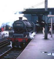 Jubilee 4-6-0 no 45593 <I>Kolhapur</I> stands at Carlisle platform 3 circa 1966, having just brought in a train from Leeds over the Settle and Carlisle route. Built by the North British Locomotive Co in Glasgow in 1934, no 45593 spent her last 18 months with BR at Holbeck shed, from which she worked many specials over the S&C in the period up to her withdrawal and later preservation in 1967.<br><br>[Robin Barbour Collection (Courtesy Bruce McCartney) //1966]