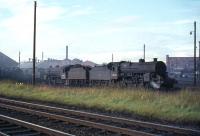 Known as <I>Horwich Moguls</I> or <I>Crabs</I>, three of these Hughes/Fowler engines are seen at Ayr MPD in August 1965. Right to left are 42740, 42909 and 42801.<br><br>[G W Robin 08/08/1965]