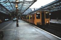 An evening service for Airdrie, formed by 314 205, awaits its departure time at Helensburgh Central in June 1986.<br><br>[David Panton 11/06/1986]