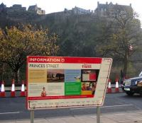 A new tram information board, plus a castle and a man in a tree. Looking south across Princes Street, Edinburgh, on 12 November 2008.<br><br>[F Furnevel 12/11/2008]