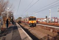 A 6-car 318 set pulls into Barassie on 12 November with a Glasgow Central - Ayr service.<br><br>[David Panton 12/11/2008]