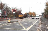 66119 emerges from the Preston dock railway land and crosses Strand Rd in Preston to join Network Rail metals. Ahead lies Fishergate Hill tunnel [See image 20278] and a 1:29 climb to Preston station. These bitumen trains to Lindsey near Immingham normally run MWF only leaving the dock at 0845 and travelling via Blackburn and the Copy Pit line.<br><br>[Mark Bartlett 14/11/2008]