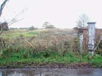 Forty four years after the level crossing gates were last opened for trains this gate and its opposite number still stand across the trackbed at the site of Hoole station. However, little else remains of the station or the Preston to Southport line that closed completely in 1964. View south west towards Hesketh Bank. Map Ref <br>
SD 467240<br><br>[Mark Bartlett 14/11/2008]