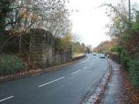 Looking north towards the village of Longton beyond the bridge abutments marking the site of Longton Bridge station, closed in 1964 with the rest of the Preston to Southport line. The right hand (eastern) abutment has been reduced in height as a small housing development now stands beyond. Since the station platforms extended over the now-demolished bridge this is effectively a view of the former station site. Map Ref SD 478253.<br>
<br><br>[Mark Bartlett 14/11/2008]