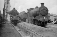 BR Standard class 4 no 80114 stands together with ex-LNER class J35 no 64483 alongside the coaling plant at Kittybrewster in July 1958. Kittybrewster shed was closed in June 1961 and subsequently demolished. Local authority offices now occupy the site.<br><br>[Robin Barbour Collection (Courtesy Bruce McCartney) 29/07/1958]