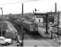 A Cravens DMU has just arrived in Ramsbottom from Rawtenstall, one week before closure. The Diesel Link drivers at Bury all remembered the days when the East Lancashire lines had an intensive freight and passenger service, including through trains to London. It must have been demoralising for them to shuttle back and forth to Rawtenstall through semi-derelict stations thinking of what had gone before. Ramsbottom had two footbridges, one either side of the crossing, but when it lost its buildings the bridge linking the platforms was demolished too. That bridge has now been restored by the ELR but the one from which this picture was taken, looking south, has gone. [See image 21764] for a modern comparison.   <br><br>[W A Camwell Collection (Courtesy Mark Bartlett) 27/05/1972]