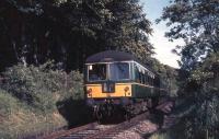 A Cravens DMU forms the leading set of the 17.18 from East Kilbride as it approaches Thorntonhall en route to Glasgow in July 1965.<br><br>[G W Robin 06/07/1965]