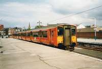 318 268 waits at Largs with a service for Glasgow Central in May 1999. <br><br>[David Panton /05/1999]