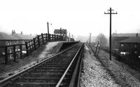 Woodhill Road Halt was the first stop on the Holcombe Brook branch after leaving the East Lancashire line at Tottington Junction. Situated in a Bury suburb this view, back down the hill towards the main line, is undated but believed taken on the last day of passenger services after the dc electrics ceased and steam push pull trains had taken over for the last fifteen months of the branch passenger services. Print credited to N R Knight.<br><br>[W A Camwell Collection (Courtesy Mark Bartlett) 04/05/1952]