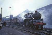 Standard class 3 mogul 77005 of Motherwell shed stands at Kingshill Colliery with <I>Scottish Rambler No 5</I> railtour on 8 April 1966.<br><br>[G W Robin 08/04/1966]