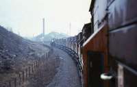 The 12 brake vans of <I>Scottish Rambler No 5</I> railtour head for Polkemmet Colliery, Whitburn, on 8 April 1966 behind BR standard class 3MT 2-6-0 no 77005.<br><br>[G W Robin 08/04/1966]