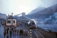 <i>Scottish Rambler No 5</i> poses at Kingshill Colliery on 8 April 1966 with BR standard class 3 no 77005 in charge of 12 brake vans. <br><br>[G W Robin 08/04/1966]