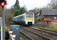 Arriva Trains Wales service from Cardiff to Manchester passes the site of the former station at Marsh Brook between Craven Arms and Shrewsbury.<br>
<br>
<br><br>[John McIntyre 18/11/2008]