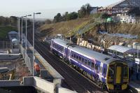 The 11.25 Bathgate - Newcraighall pauses at Livingston north on 25 November. The old staircase has been removed as work continues on site.<br><br>[James Young 25/11/2008]